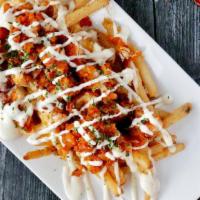 Downtown Buffalo Chicken Fries · Seasoned fries, with Melted Cheddar and Jack Cheese, bacon bits, crispy chicken tenders toss...