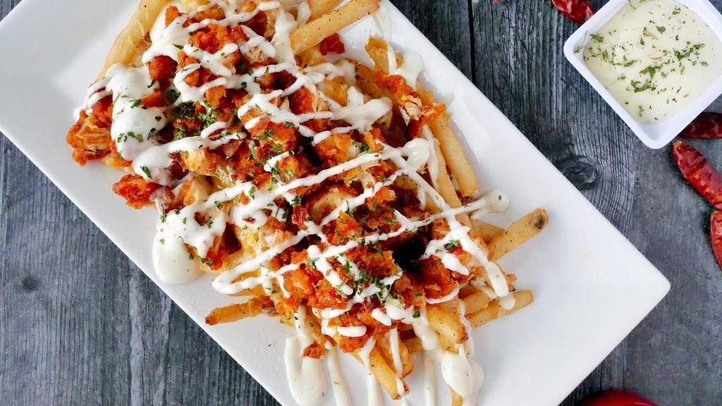 Downtown Buffalo Chicken Fries · Seasoned fries, with Melted Cheddar and Jack Cheese, bacon bits, crispy chicken tenders tossed in our house-made Buffalo sauce and topped with our house-made Ranch Dressing.