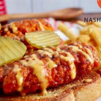 Nashville Hot Chicken Plate · Three crispy fried chicken tenders | tossed in Nashville Hot sauce | dill pickles | creamy G...