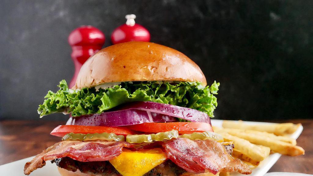 Bacon Cheese Burger · A hefty gourmet charbroiled Angus patty,. hand-prepared and served with Apple wood bacon,. Cheddar cheese, Green leaf lettuce, onions,. tomatoes, pickles, mayo. Served on a Brioche Bun. W/French fries.