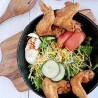 Wing Salad · Four fried chicken wings, atop a mix of fresh salad greens, tomatoes, carrots, hard-boiled e...