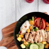 Grilled Chicken Salad · Grilled marinated chicken breast, atop a mix of fresh salad greens, tomatoes, carrots, hard-...
