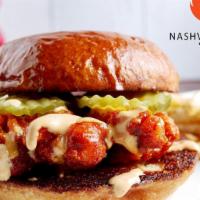 Nashville Hot Chicken Sandwich · Two crispy fried chicken tenders  | Nashville Hot sauce | dill pickles | creamy garlic Haban...