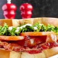 Blt · Maple Bacon, lettuce, tomatoes, mayo on Brioche bread. Served with French Fries.