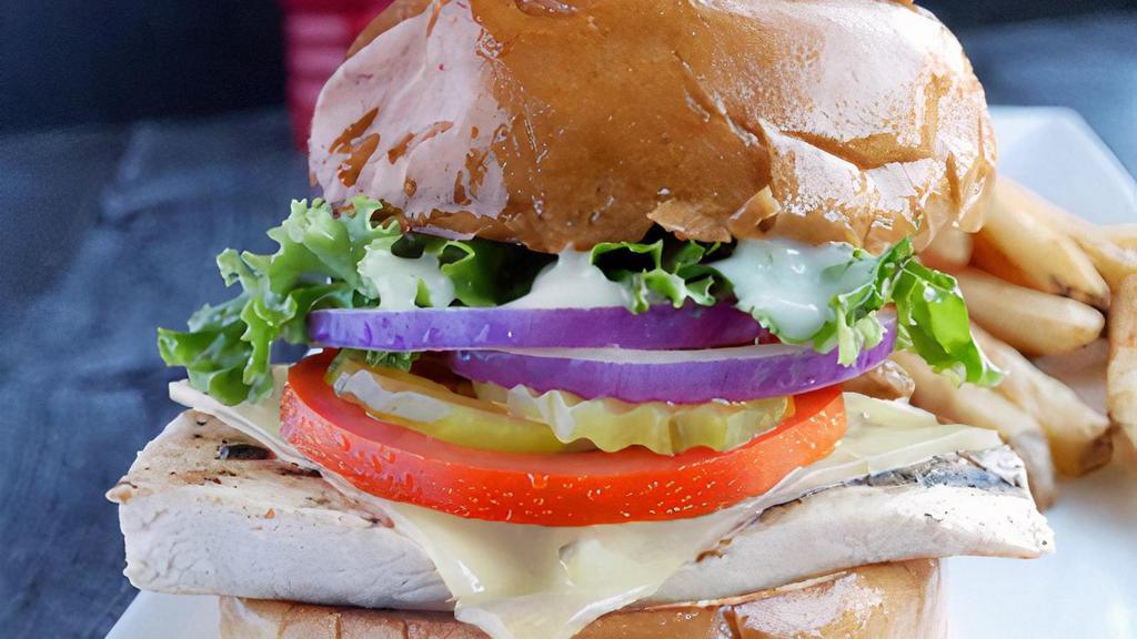 Grilled Chicken Sandwich · Grilled marinated chicken breast, topped with Pepper Jack cheese, lettuce, tomatoes, pickles and mayo. Served on a Brioche Bun W/French fries.