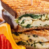 Egg White & Spinach Breakfast Panini · Egg whites, sautéed spinach & mozzarella cheese grilled on wheat bread. Served with mild tom...