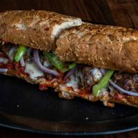 Meatball Sandwich · Served with meat sauce, green peppers and onions. Served hot on an oven-toasted roll with Pr...