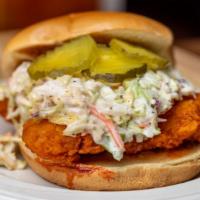 Buffalo Chicken Sandwich (R) · Toasted brioche bun with crispy chicken tender tossed in buffalo, coleslaw, pickles and ranch!