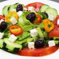 Greek Salad · Tomatoes, grape tomatoes, cucumbers, ren onion, bell pepper, fresh parsley, fresh oregano, f...