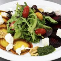 Oven Roasted Beet Salad · Arugula, goat cheese, toasted pecans, dried cranberries with balsamic dressing.