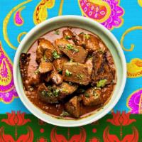 Lamb Curry · Lamb cooked with herbs and spices in a curry sauce.