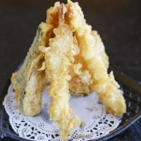 Shrimp Tempura · Fresh shrimp and seasonal vegetables lightly fried, served with tempura sauce.