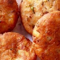 Aloo Tikki · Two shallow fried, potato patties cooked with special masala flavor.. (Vegan, Vegetarian)