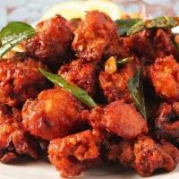 Chicken 65 · Boneless deep-fried chicken cooked with green peppers, onions and chili sauce with a hint of...