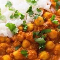 Chana Masala · Chickpeas cooked in a tomato sauce with a special blend of Indian spices.  Served with Basma...