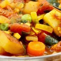 Vegetable Curry · Assorted fresh vegetables cooked in a curry sauce.  Served with Basmati rice.  . (Vegan, veg...