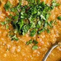 Dal Tadka · Yellow lentil curry, tempered with special spices and herbs.  Served with Basmati rice.  ( v...