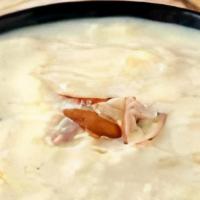 Kheer · Rice pudding simmered gently with almonds and pistachios.