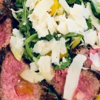 Steak & Arugula Salad · Grass fed tender grilled steak on a bed of organic wild arugula, heirloom cherry tomatoes & ...