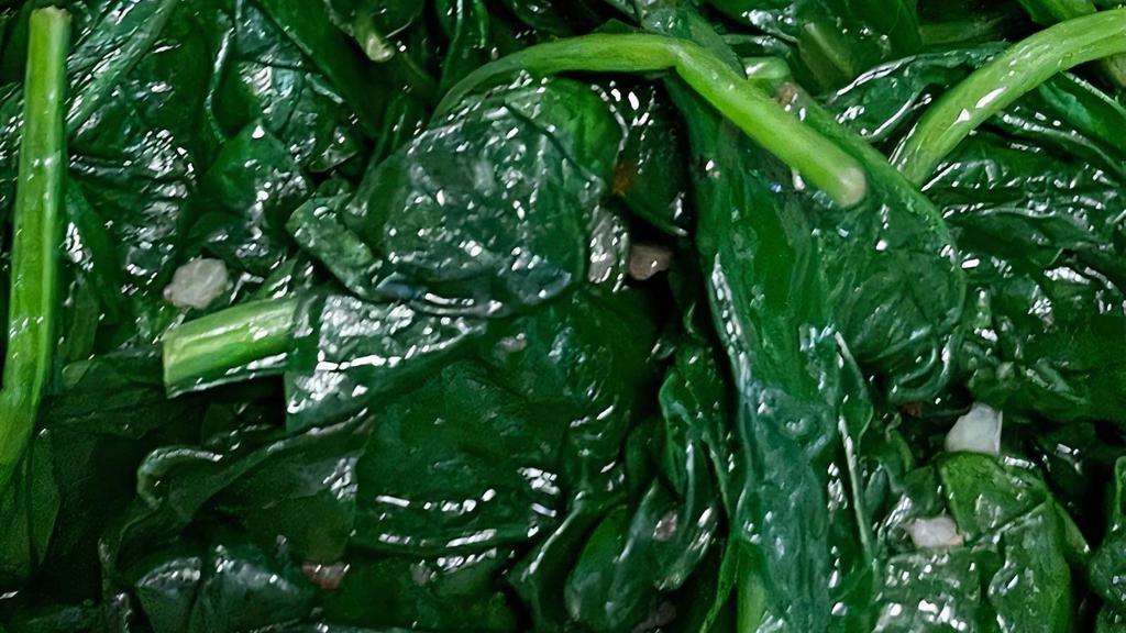 Sautéed Spinach · Organic spinach sautéed in light garlic and EVOO