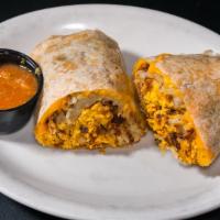 Breakfast Burrito · Your choice of chicken, sausage, shredded beef, ham, bacon or chorizo with scrambled eggs, c...