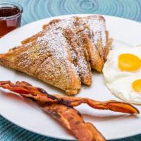 French Toast Combo · Two thick slices of French Toast and two eggs and style served with two strips of bacon or o...