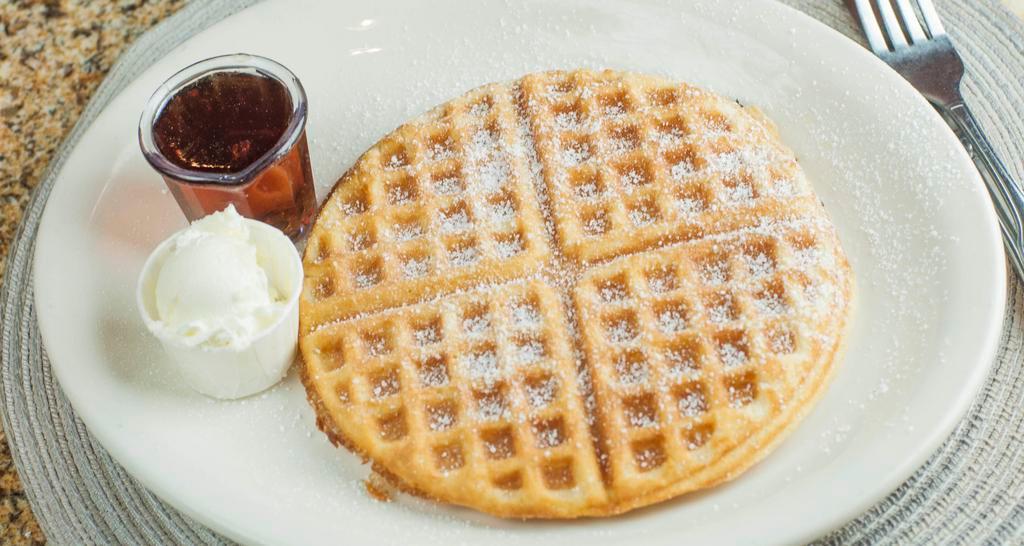 Waffle · A delicious homemade waffle, topped with powdered sugar