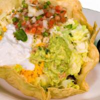Taco Salad · In a giant tortilla shell with choice of ground beef, chicken or shredded beef with pico de ...