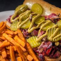 Hot Pastrami Sandwich · Hot pastrami and Swiss cheese with dill pickles and choice of brown or yellow mustard on a h...