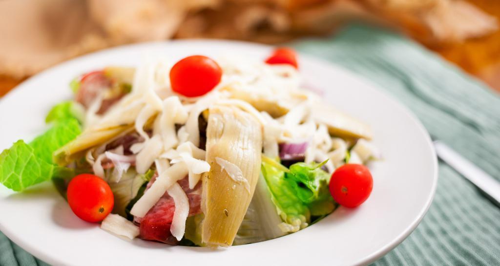 Antipasto Salad · Romaine, salami, marinated artichoke hearts, tomatoes, olives, red onion, mozzarella, Italian dressing.