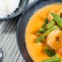 Red Curry · Your choice of meat cooked in coconut milk with squash, eggplant, green bean, green & red be...