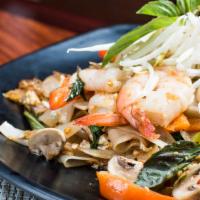 Drunken Noodles · Pan fried flat rice noodles with egg, tomato, green bell pepper, red bell pepper, bean sprou...