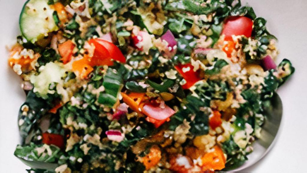Kale & Quinoa Salad · Green kale, quinoa, romain, tomatoes golden raisins, Parmesan cheese and toasted almonds, with our lemon herb dressing.