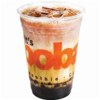 Tiger Sugar Black Tea Latte · Tiger stripes formed as a layer of sweet brown sugar with black tea and milk.
