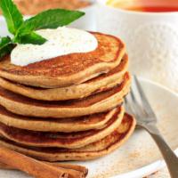 Cinnamon Pancakes · Airy, fluffy and delicious flavored pancakes with strawberry, banana, blueberry, and powdere...