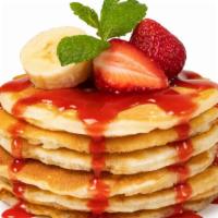 The Fruit Pancakes · Delicious 3 rolled pancakes filled with butter with strawberry, banana, blueberry topped wit...
