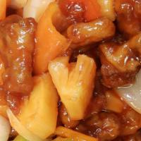 Sweet And Sour Pork · Crispy pork with white onion, bell pepper and pineapple in sweet & sour sauce.