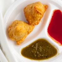 Vegetable Samosa (2 Pieces) · Vegetarian. Lightly spiced Indian turnovers, stuffed potatoes, and peas.