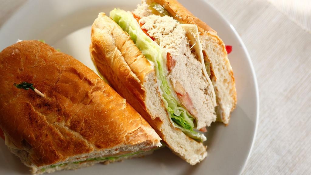 Ham Or Tuna Or Turkey · All sub sandwiches serves with lettuce, tomatoes, pickles & choice of mayo or hummus & choice of American or Swiss cheese.