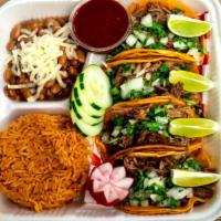 Taco Plate · 4 Birria tacos + Mexican Rice and Pinto Beans on the side.