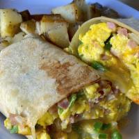 Breakfast Burrito · Ham, onion, green bell pepper, cheddar cheese, and 3 scrambled eggs wrapped in a flour torti...