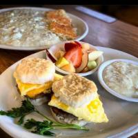 Breakfast Sliders · Two biscuit sandwiches with sausage patties, scrambled eggs, and cheddar cheese. Served with...