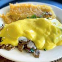 Florentine Benedict · Spinach, mushroom, two poached eggs, and a toasted English muffin topped with hollandaise sa...