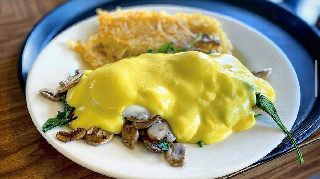 Florentine Benedict · Spinach, mushroom, two poached eggs, and a toasted English muffin topped with hollandaise sauce.