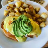 Salmon Benedict · Smoked salmon, two poached eggs, and a toasted English muffin topped with hollandaise sauce.