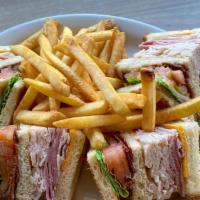 Mom'S Club · Bacon, lettuce, tomatoes, turkey breast, ham and American cheese layered between 3 slices of...