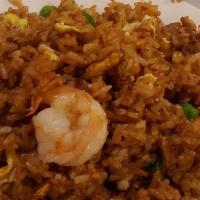 Fried Rice · Wok-fried rice blended with shredded eggs, peas, and green onions. Includes your choice of b...