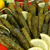 Dolma (10 Pc) · Rice, onions, parsley and spices, rolled in grape leaves.