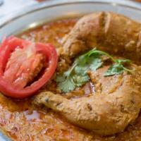 Chicken Karahi · Boneless Chicken cooked with sautéed onion, garlic, ginger, and tomato.