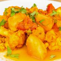 Aloo Gobi · Pan sautéed potato and cauliflower with special mild spicy sauce.
